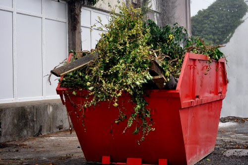 Workers managing builders waste clearance in Wimbledon